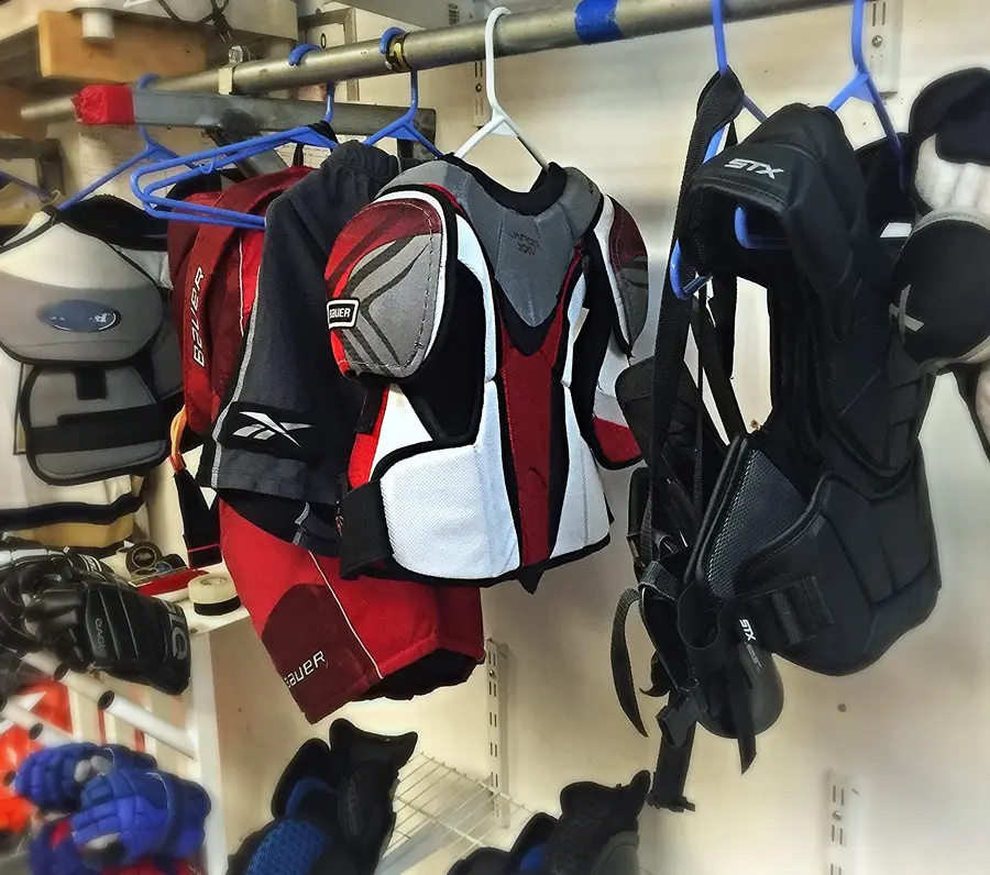 Freshly cleaned hockey gear hanging in the No Sweat shop